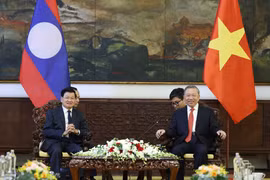 苏林会见老挝人民革命党中央委员会总书记、国家主席通伦·西苏里。图自越通社