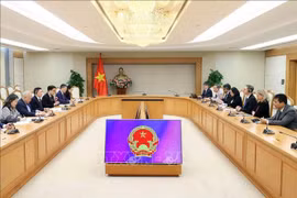 会见现场。图自越通社