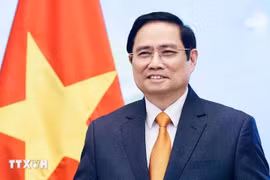 政府总理范明政。图自越通社