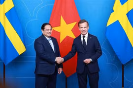 越南政府总理范明政与瑞典首相乌尔夫·克里斯特松。图自越通社