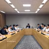 双方工作会谈现场。图自越通社