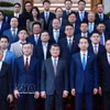 越南政府总理黎明兴与在越中资企业代表合影。图自越通社