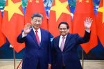 越南政府总理范明政会见中共中央总书记、国家主席习近平。图自越通社