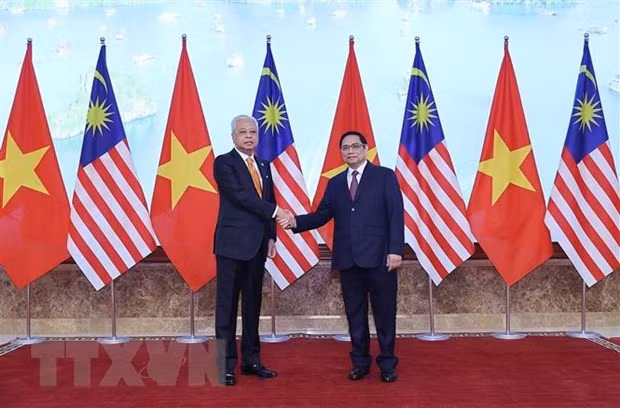 越南与马来西亚发表联合新闻公报 ảnh 1 越南与马来西亚发表联合新闻公报 ảnh 1