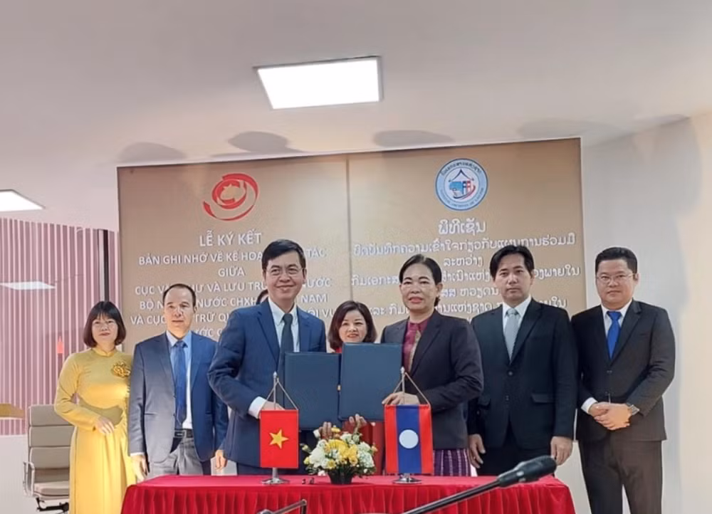 越南与老挝加强在文书档案领域的合作 ảnh 1 越南与老挝加强在文书档案领域的合作 ảnh 1