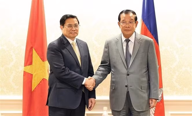 越南政府总理范明政会见柬埔寨首相洪森 ảnh 1