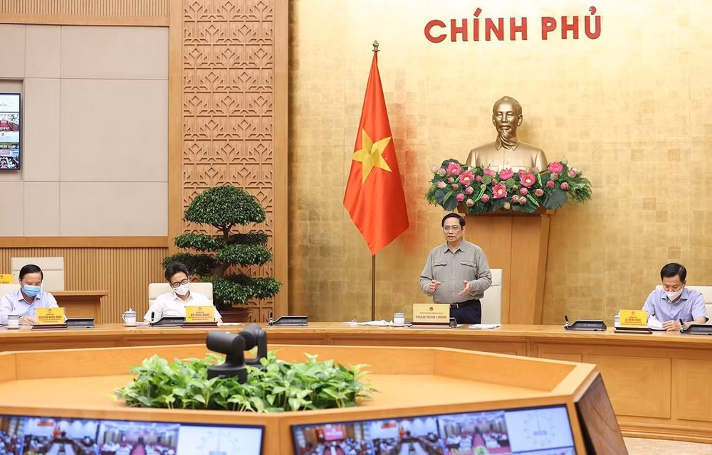 越南政府总理：全国各地统一安全适应和有效控制疫情 ảnh 1