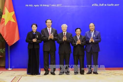 越南国家主席陈大光:愿为维护和继续培育越老特殊团结关系作出努力 ảnh 2 越南国家主席陈大光:愿为维护和继续培育越老特殊团结关系作出努力 ảnh 2