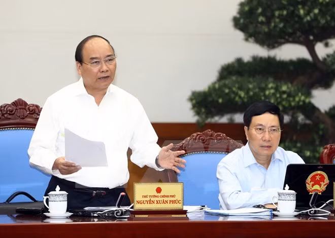 政府总理阮春福：正确评估每个行业和领域现状 力争完成2017年各目标 ảnh 1