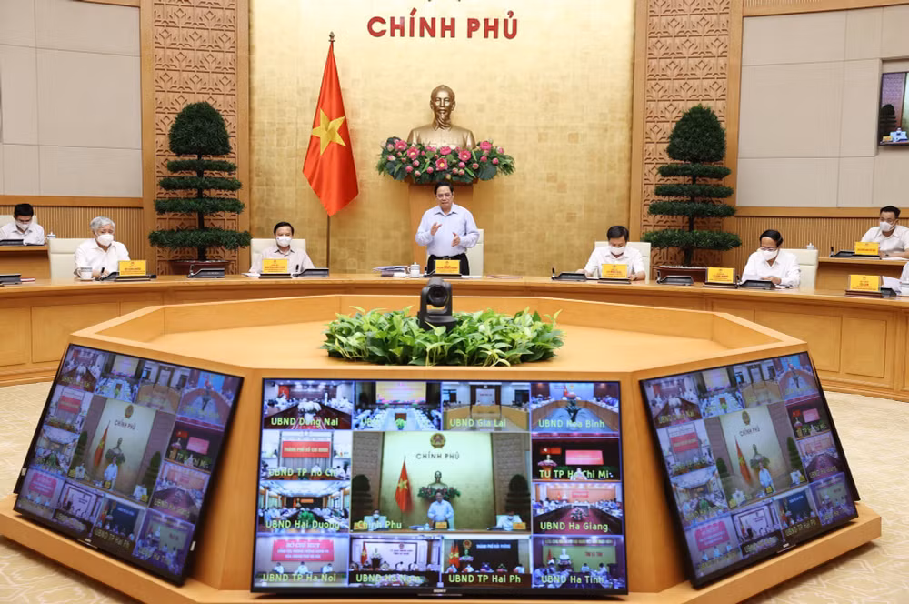 越南政府总理范明政主持召开全国新冠肺炎疫情防控工作视频会议 ảnh 1