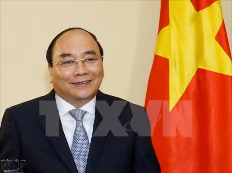 阮春福总理前往柬埔寨出席世界经济论坛东盟峰会 ảnh 1