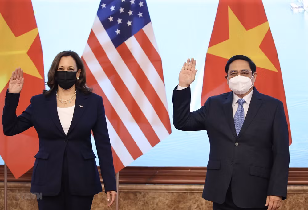 越南政府总理范明政会见美国副总统哈里斯 ảnh 1 越南政府总理范明政会见美国副总统哈里斯 ảnh 1