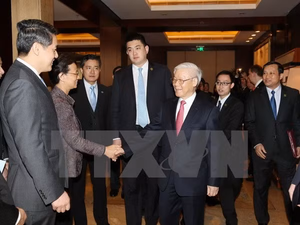 越共中央总书记阮富仲：企业为促进越中经济合作关系做出贡献 ảnh 1