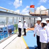 各位代表参观PTSC工厂。图自越通社
