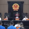 河内市人民法院一审公开开庭审理阮伯欢及其他27名被告。图自越通社
